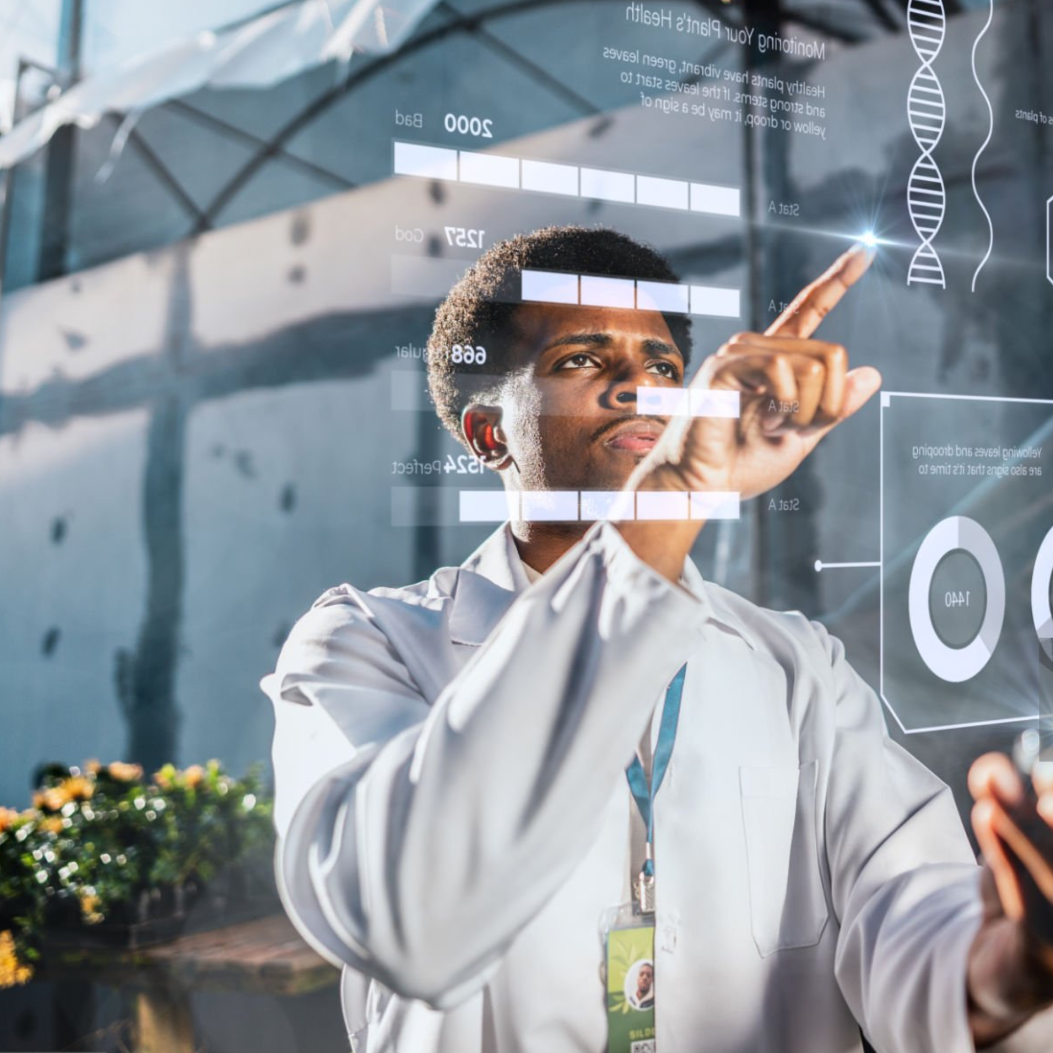Research in IoT for health A young man with a white lab coat exploring data analytics